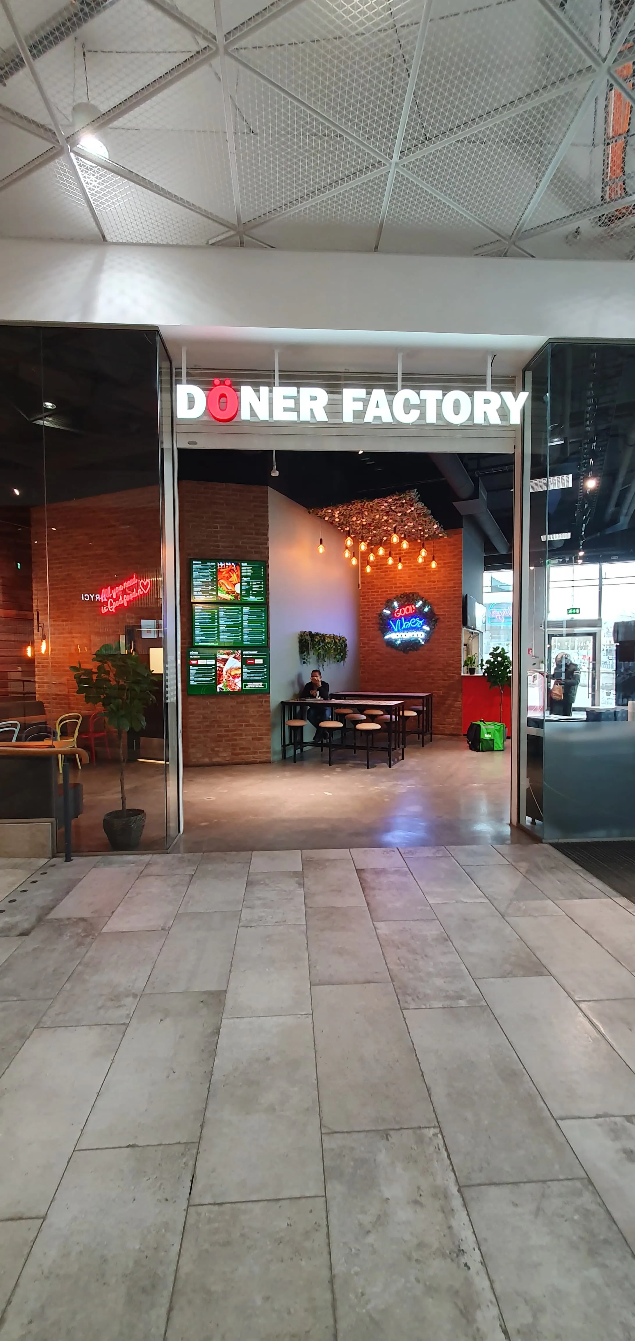 Tall atrium view looking across the Doner Factory interior.