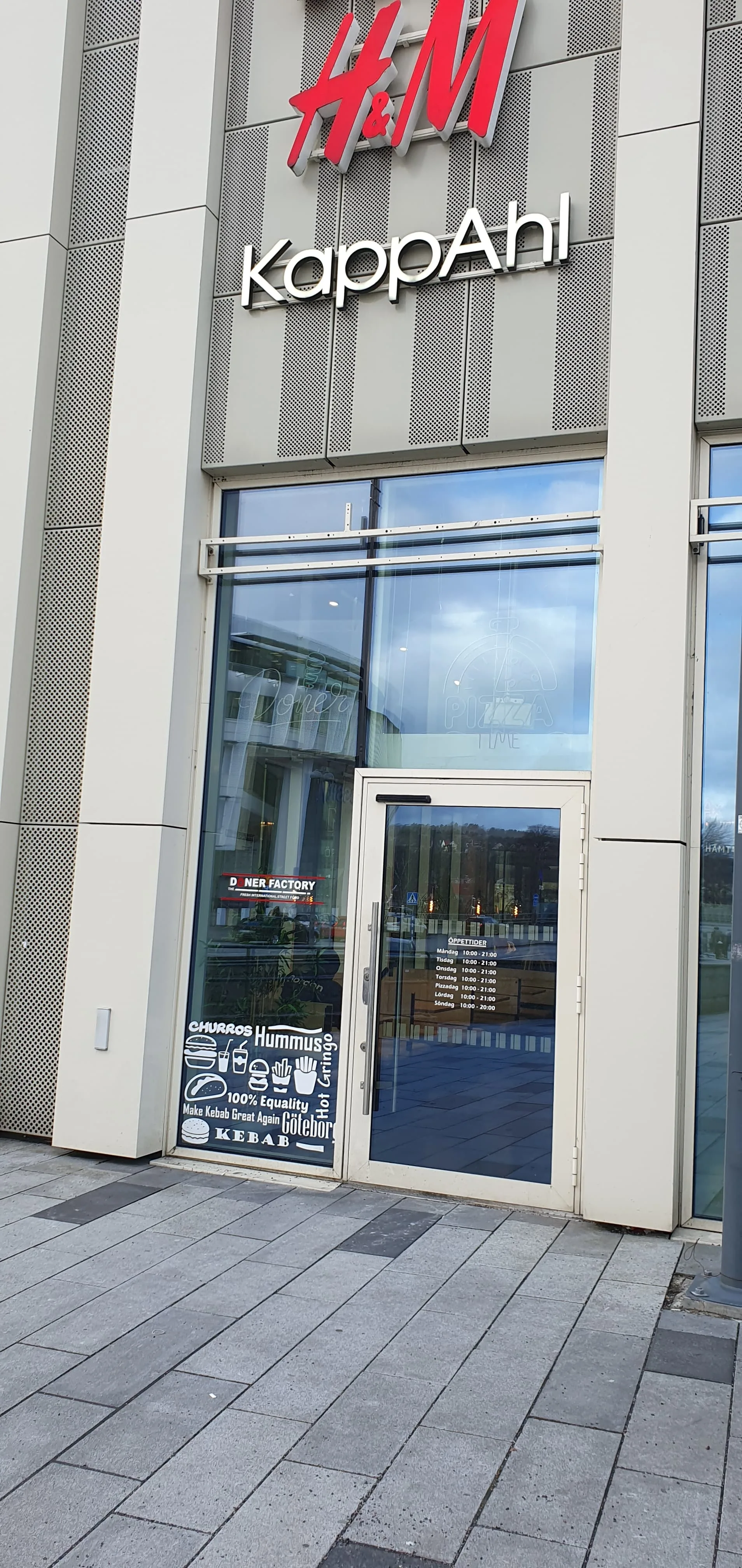 Tall shot of the Doner Factory entrance and signage.